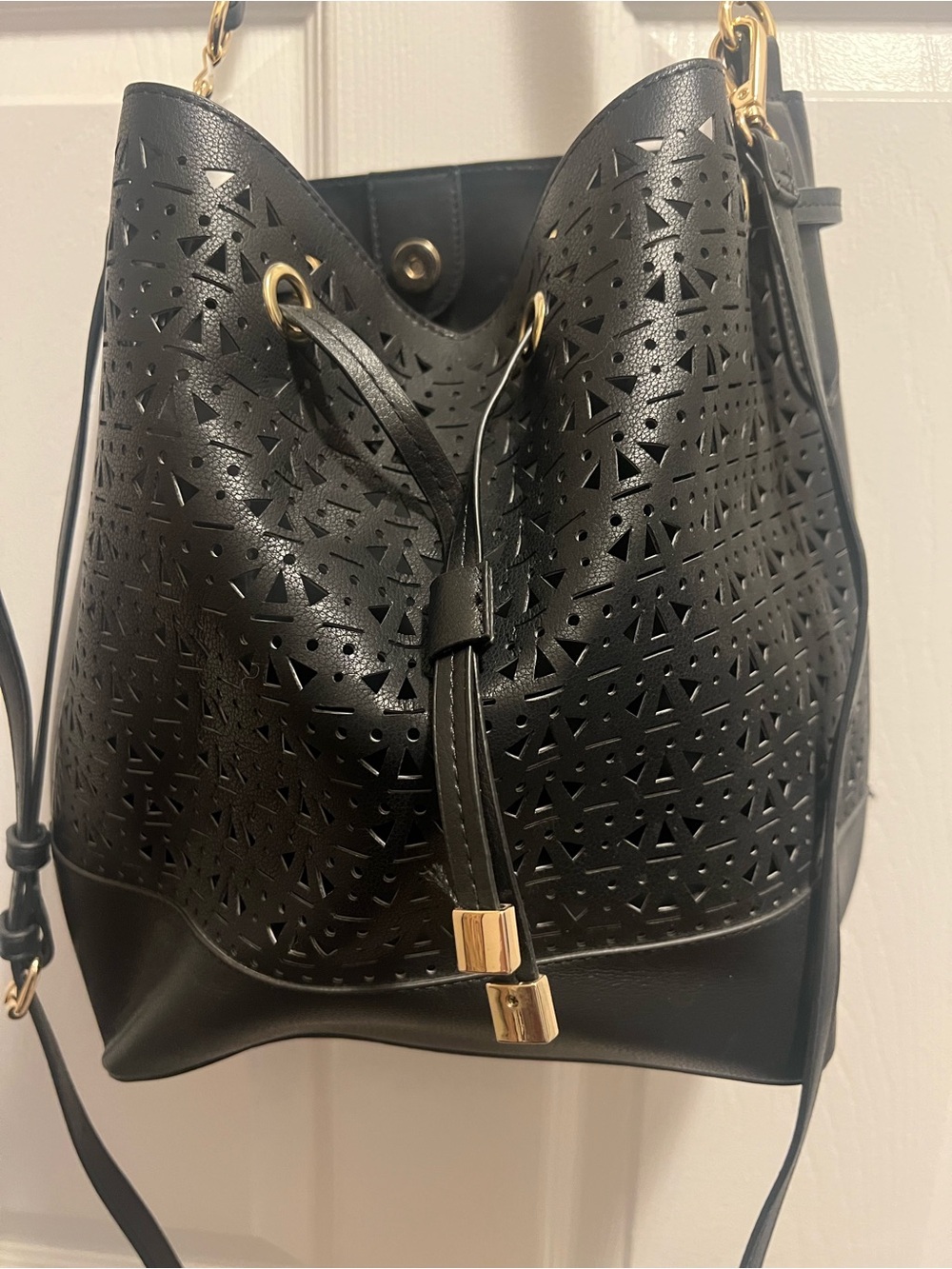 Black Laser-Cut Bucket Bag with Gold Hardware